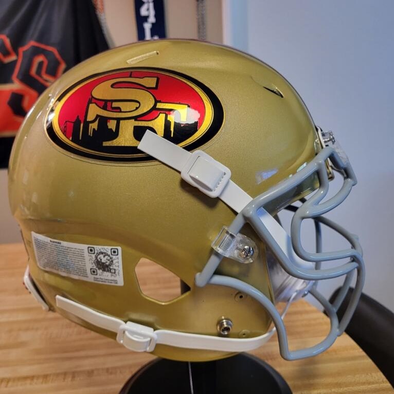 A San Francisco 49ers helmet with a logo containing the San Francisco skyline.